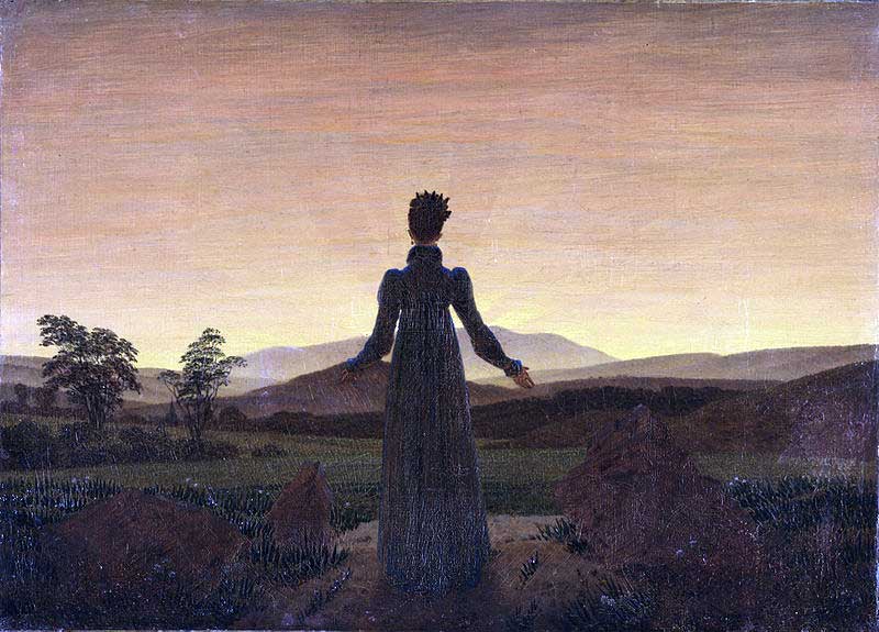 Mujer ante el sol poniente